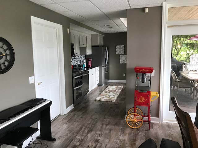 Basement Remodel with stone feature wall and flooring