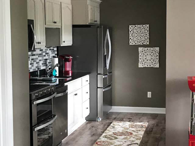 Basement Remodel with stone feature wall and flooring