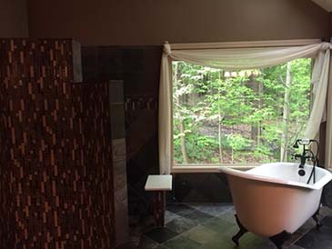 slate master bath with soaking tub