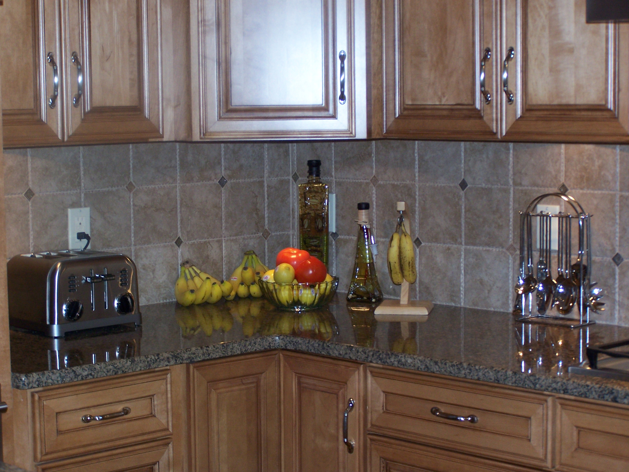 Marble Tiled Backsplash and Granite Counters